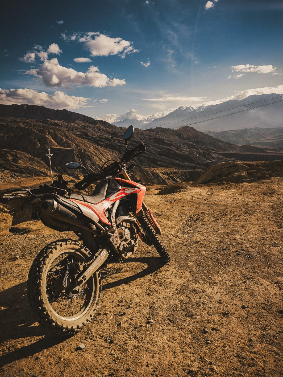 Lone rider looking over a Himalayan gorge